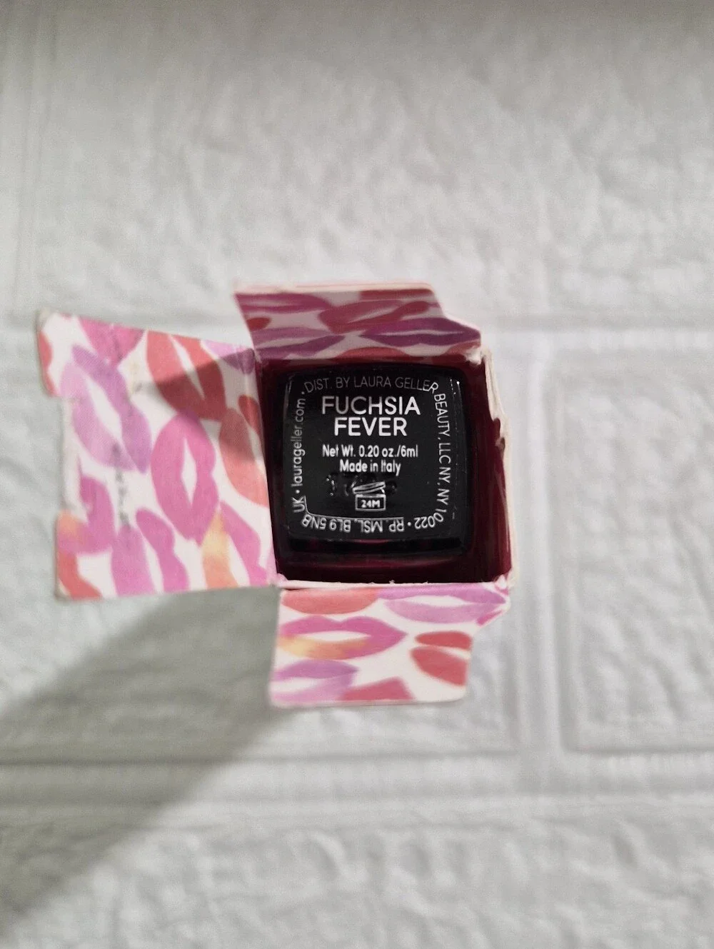 Laura Geller Luscious Lips Liquid Lipstick packaging in the shade Fuschia Fever